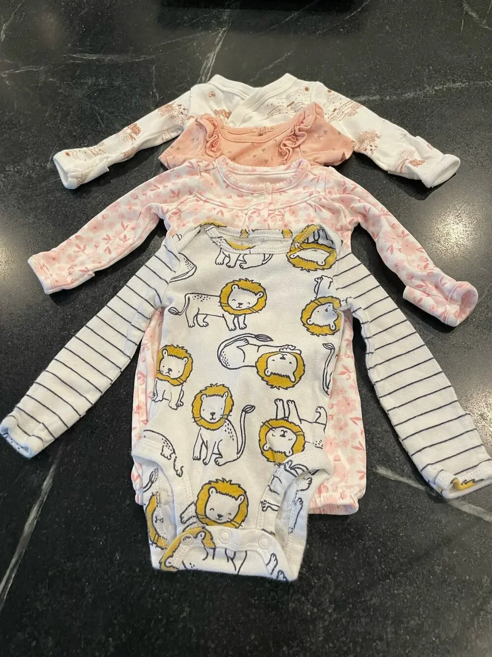 Carter’s Bundle of  4 (four) Preemie / newborn onesies.